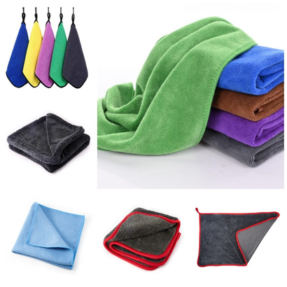 Colorful microfiber towels in various sizes and styles, including bordered and looped designs displayed as part of Genuscars